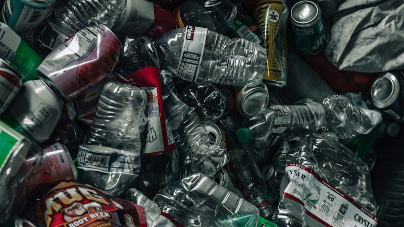 Pile of plastic bottles ready to be return for waste collection.