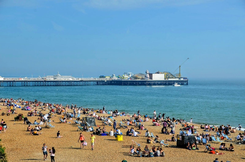 Brighton Beach and Brighton Pier in the sun.